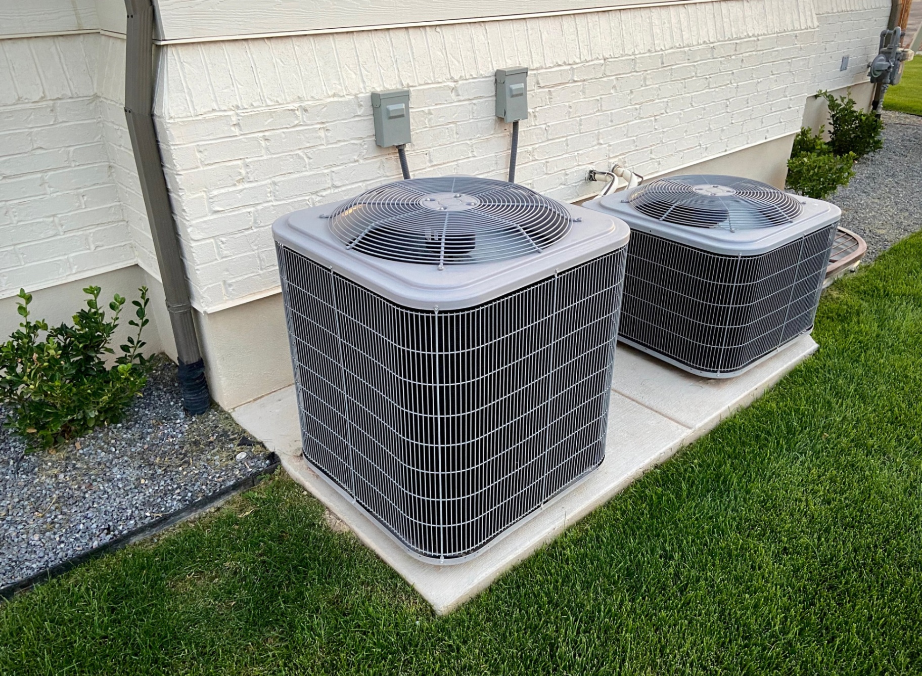 Dual residential AC condenser units installed by Heat and Air Rescue